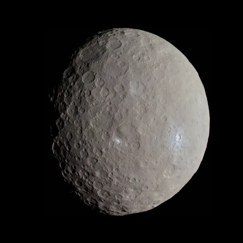 A gray, heavily cratered round world against black space, lit from the right, with two small bright white spots