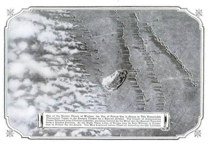 An old printed page with a black-and-white aerial photograph of fields, where white clouds drift away from lines of trenches, and a printed caption below