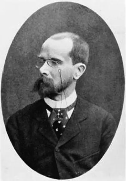 An old black-and-white portrait, in an oval frame, of a balding man with a pointed beard and pince-nez glasses, in a dark suit and patterned tie