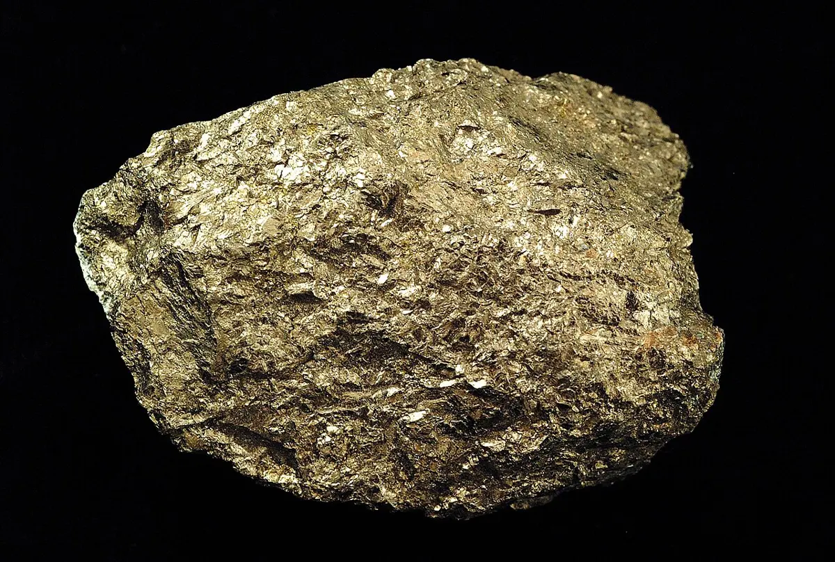 A heavy-looking lump of rock with a dull, yellowish-bronze metallic shine