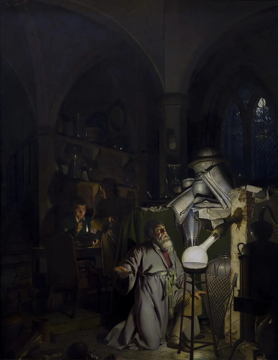 A dark painting of a vaulted room: an old bearded man in a robe kneels before a round glass flask that glows with a bright white light, while two young assistants watch from a table behind