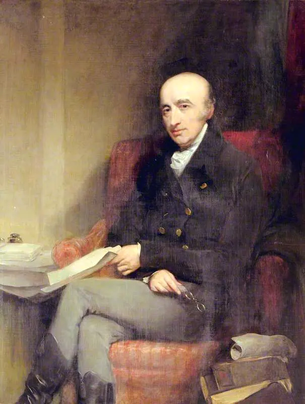 A painting of a bald, thin-faced man in a dark coat and white neckcloth, sitting in a red armchair with papers in his hand and books beside him