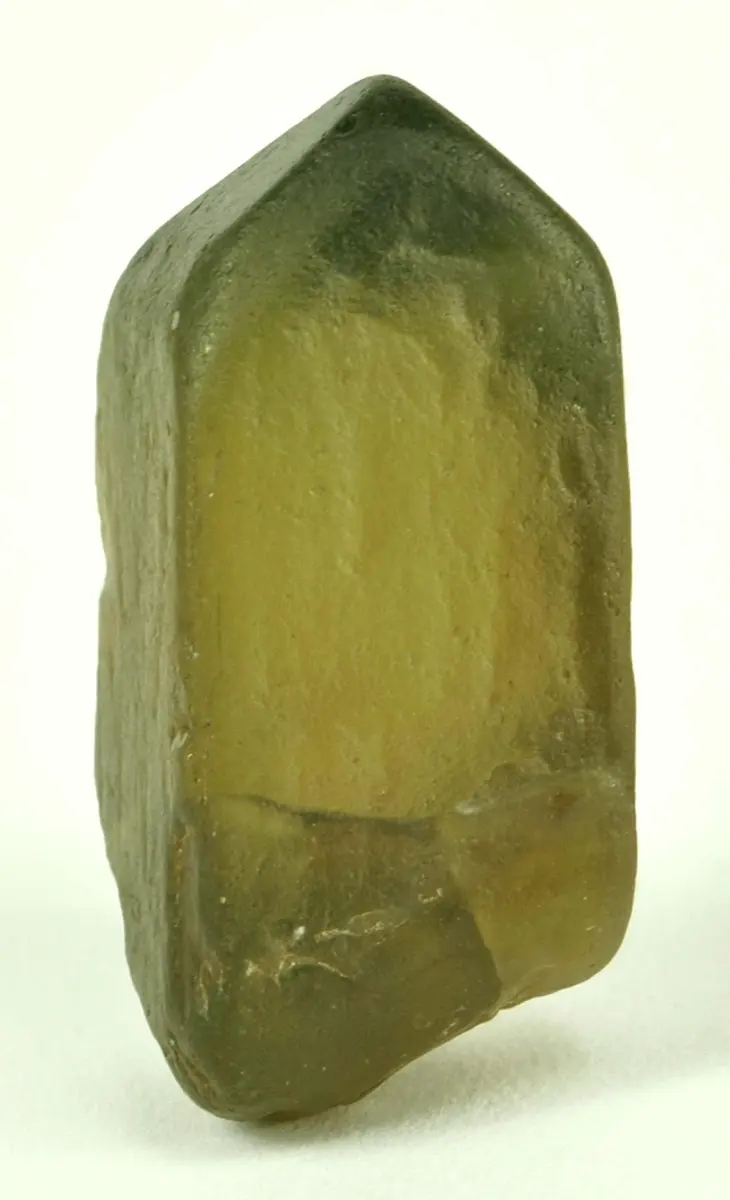 A single six-sided crystal of greenish-brown, slightly see-through stone, pointed at the top