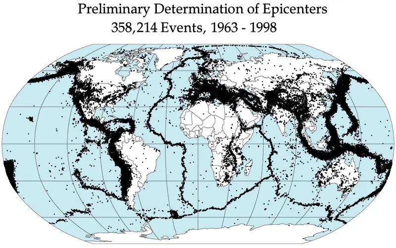 A map of the world, land white and sea pale blue, covered in black dots that crowd into narrow belts around the Pacific, along the middle of the Atlantic and Indian Oceans, and across southern Asia through the Himalaya