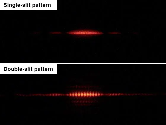 Two photographs, one above the other, of red laser light on a screen: the top shows a single bright patch with fainter patches on each side; the bottom shows the same patch divided into many narrow red stripes with dark gaps