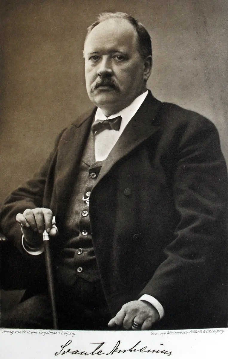 An old sepia portrait of a seated, heavily built man with a mustache, in a dark suit and bow tie, one hand on a walking stick