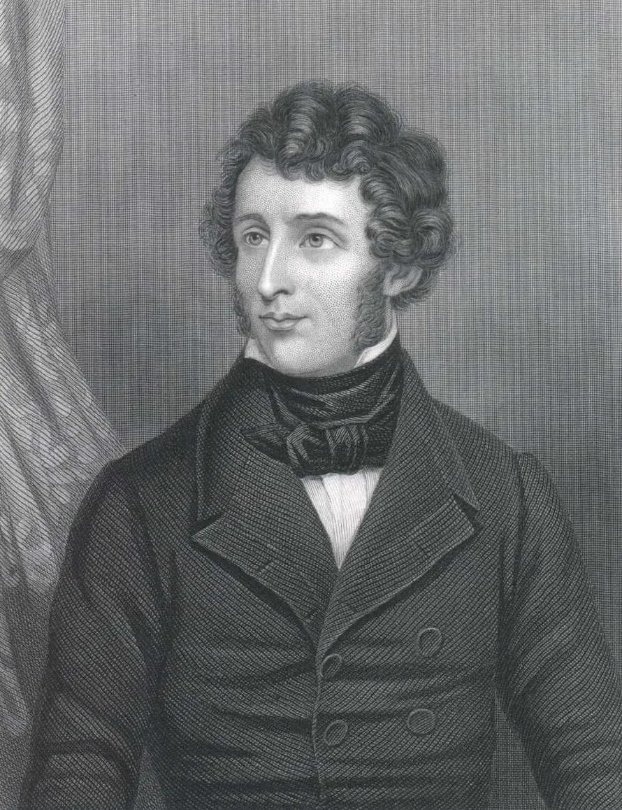 An engraved portrait of the young Friedrich Wöhler, with dark curly hair and a high collar
