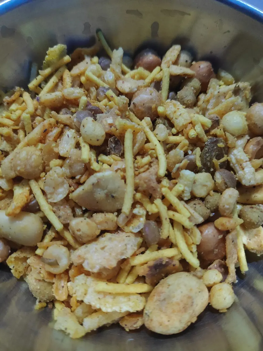 A heap of fried lentils, peanuts and crunchy yellow gram-flour noodles