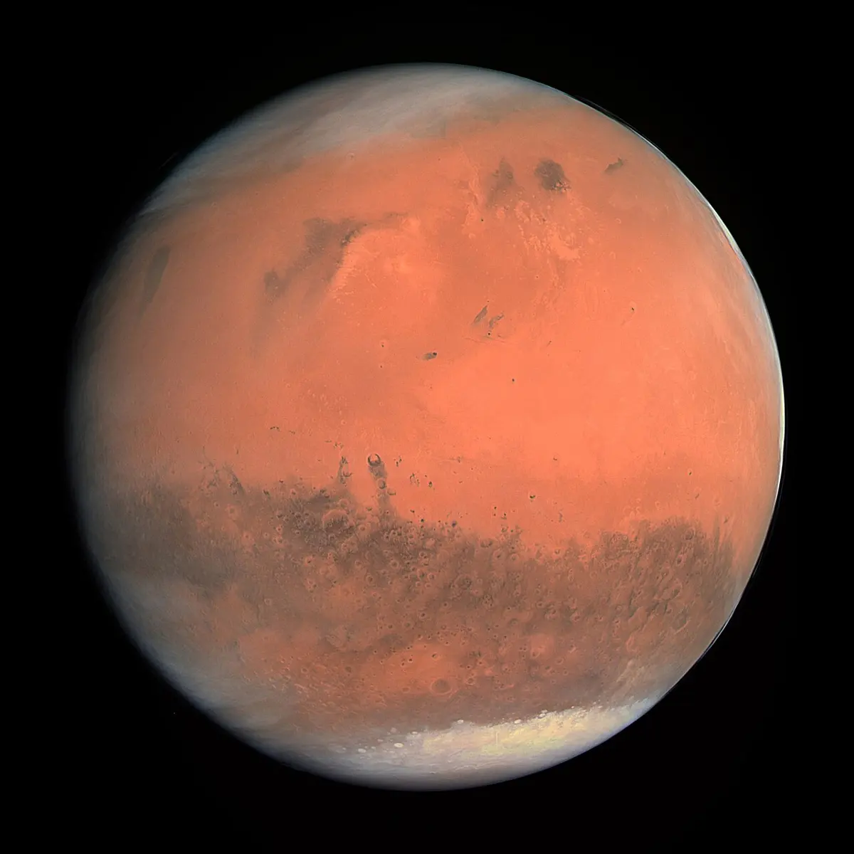 गाढा दागहरू भएको र एउटा ध्रुवमा बरफको सेतो टोपी भएको रातो-सुन्तले ग्रह