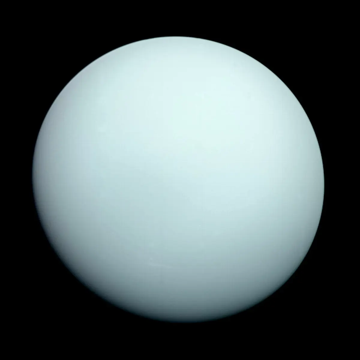 A smooth, pale blue-green ball against black space