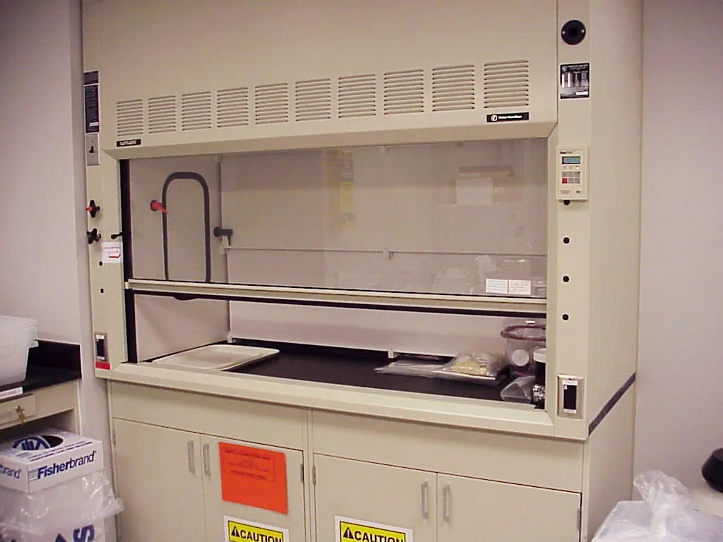 A fume cupboard in a laboratory, a cabinet with a sliding glass front