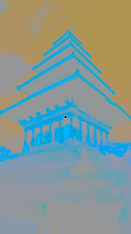 A photo of the Nyatapola temple in Bhaktapur in strange colors: an orange sky and blue-green temples, with a black dot in the middle