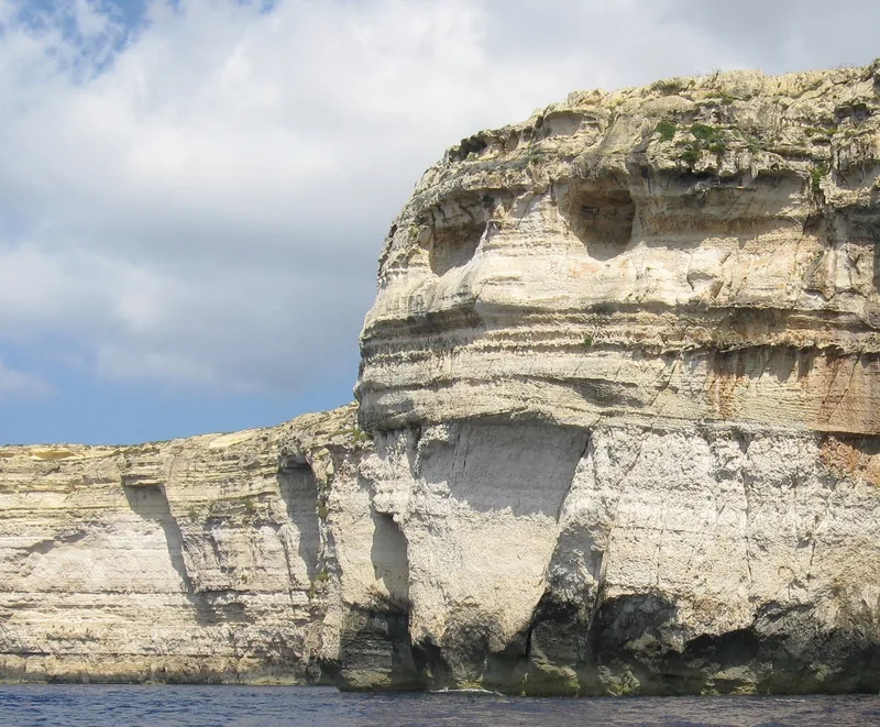 A cliff on the coast of Gozo, Malta, that looks like a face in profile
