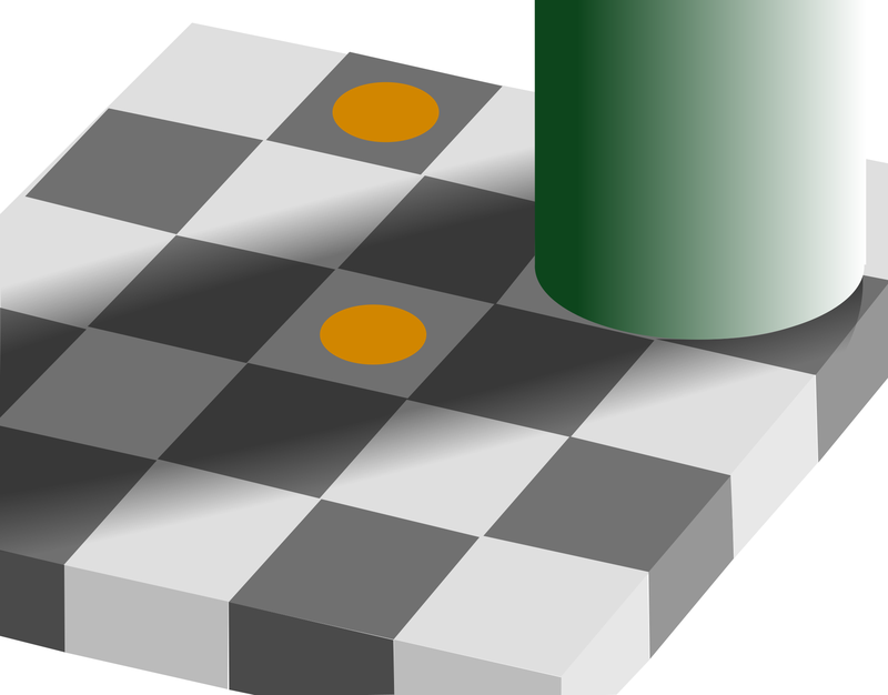 A checkerboard in shadow with two orange circles, one in the light and one in the shadow