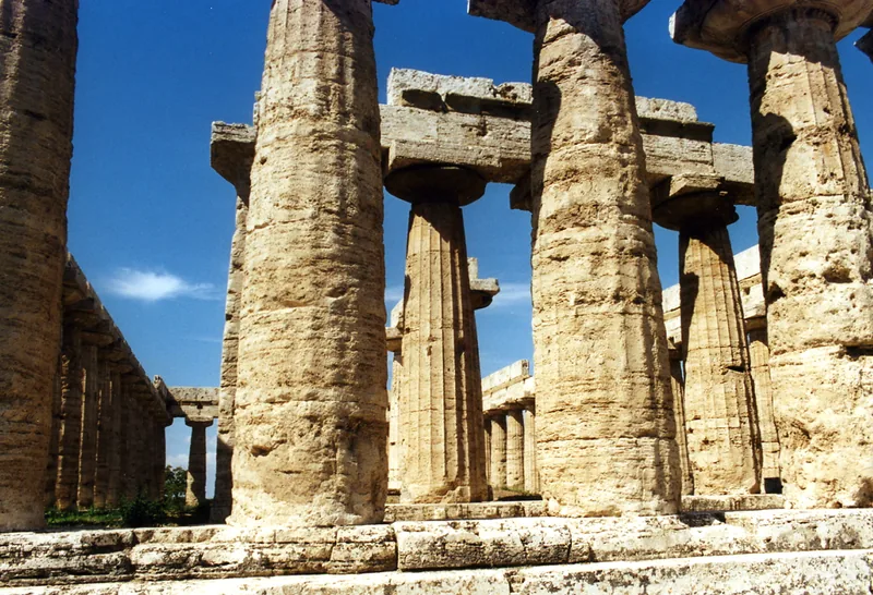 The stone columns of an old Greek temple, slightly fatter in the middle