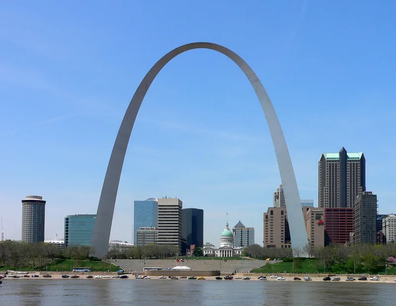 The Gateway Arch in St. Louis, a tall steel arch, above the city skyline