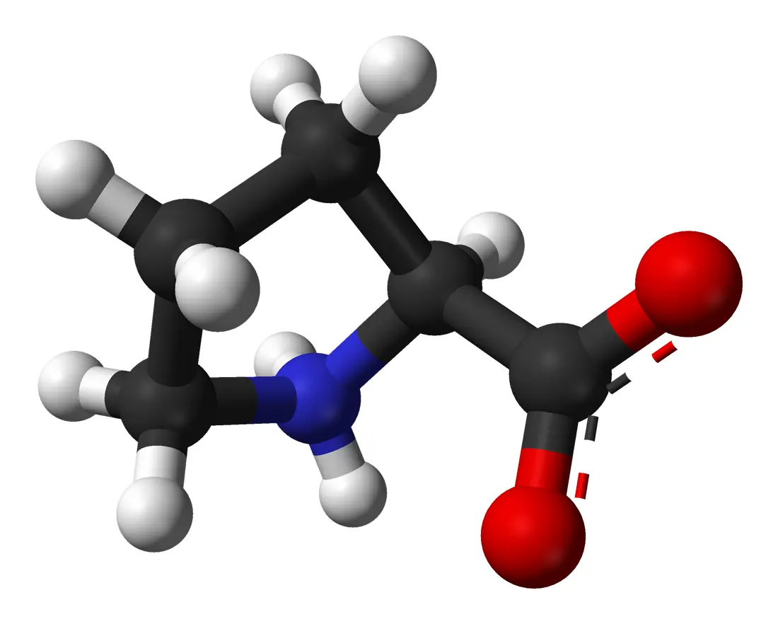 A ball-and-stick model of a small molecule: a ring of four black carbon balls and one blue nitrogen ball, with white hydrogen balls around it and two red oxygen balls on one side