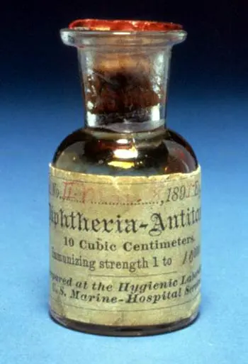 A small old brown glass bottle with a stopper, its paper label reading Diphtheria-Antitoxin, 10 cubic centimeters, prepared at the Hygienic Laboratory, U.S. Marine-Hospital Service