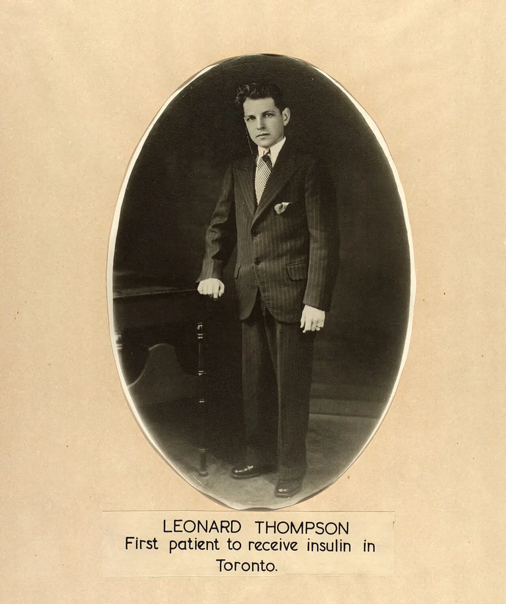 An oval studio portrait of a young man in a striped suit and tie, standing with one hand on a small table, above a label: Leonard Thompson, first patient to receive insulin in Toronto