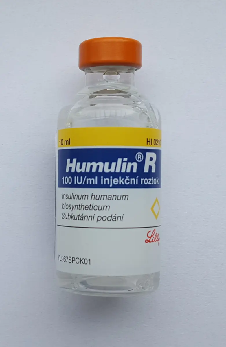 A small glass bottle of clear liquid with an orange cap and a label reading Humulin R, 100 IU/ml