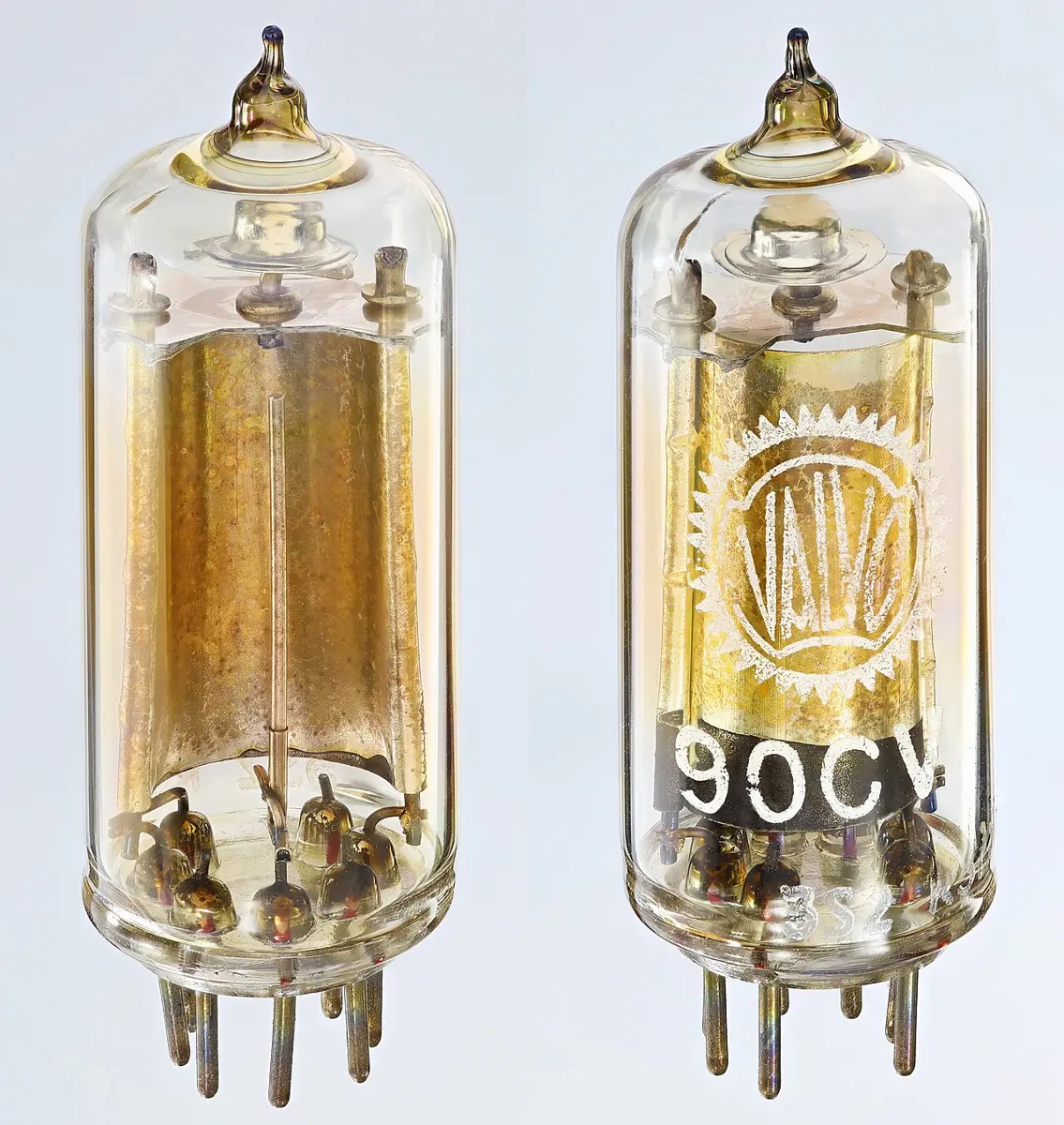 Two views of a small glass tube with metal pins at its base; inside is a curved golden-brown metal sheet with a thin straight wire standing in front of it