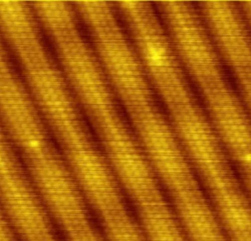 A square image in orange and brown, with wide diagonal stripes, and very fine rows of tiny dots running along the stripes