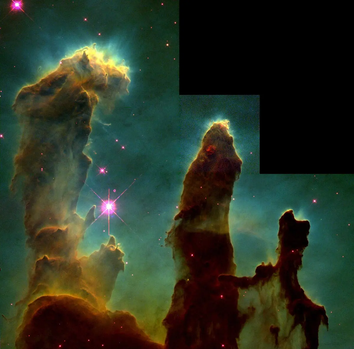 Tall dark brown pillars of gas and dust rising against a glowing blue-green background, with bright edges; the top right corner of the picture is cut away in a black step shape