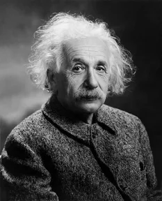 A photograph of Albert Einstein with his famous white hair and mustache