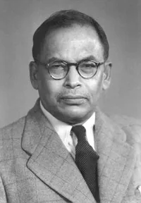 A photograph of Meghnad Saha in glasses