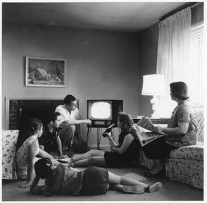 A family watching a television set together at home, about 1958