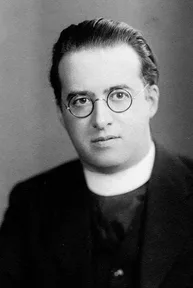 A photograph of Georges Lemaître in a priest’s collar, in the early 1930s