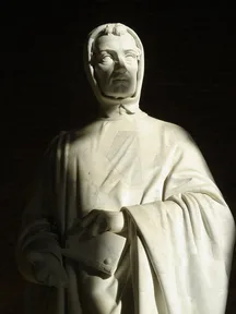 A marble statue of Fibonacci in a long robe, in Pisa