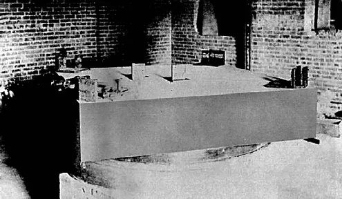 A drawing of the Michelson–Morley apparatus: mirrors and a lamp on a heavy stone slab floating in mercury