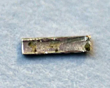 A tiny sample of radium on a piece of copper foil