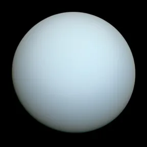 The planet Uranus, a smooth pale blue-green ball, photographed by Voyager 2 in 1986